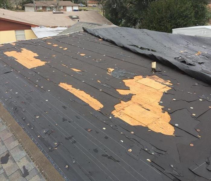 storm damaged roof before tarp was placed