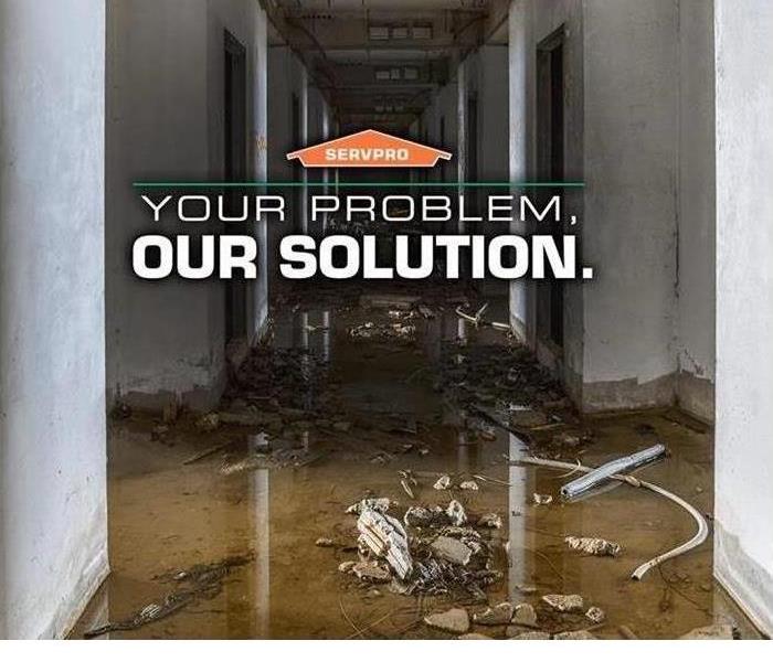 water damage in commercial facility with graphic "Your Problem, Our Solution."